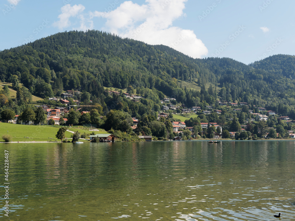 View to the lake of Tegernsee in Upper Bavaria Germany, Rottach-Egern, Church of St. Laurentius and small mountain above the town of Tegernsee