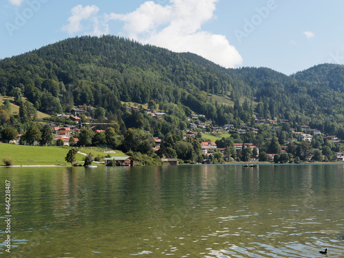 View to the lake of Tegernsee in Upper Bavaria Germany, Rottach-Egern, Church of St. Laurentius and small mountain above the town of Tegernsee photo