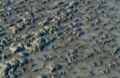 Original texture of wet gray sand of mountain river Mzymta in Adler. A great background for any natural design.