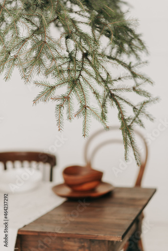 green spruce branch and beautiful decorated new year table close up