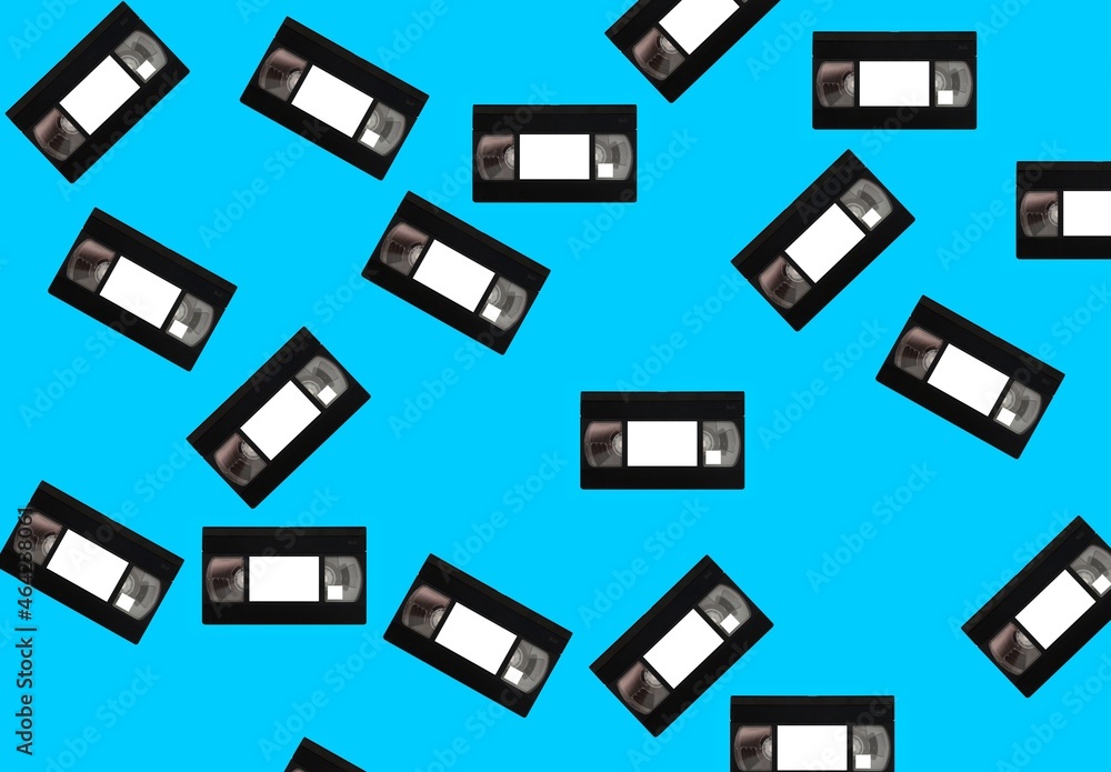 Background, banner and wallpaper for design. An old 3d videotape from different angles, chaotic on a blue background. Pattern Background, banner and wallpaper for design. An old 3d videotape from different angles, chaotic on a blue background. Pattern