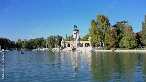 Tourists enjoying boats in Buen Retiro Park Lake, famous landmark in Madrid, Spain. High quality 4k footage