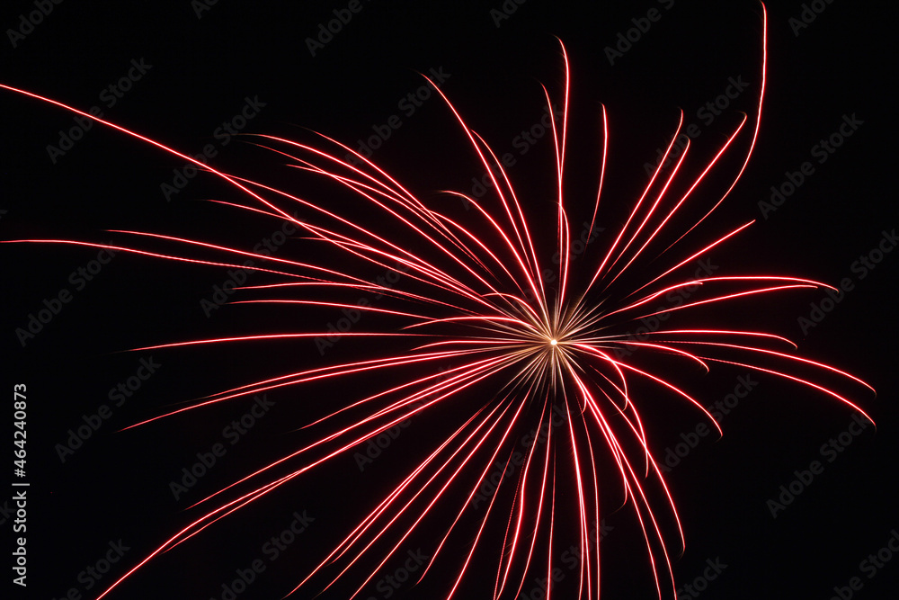 Celebratory fireworks. Fireworks at night against a dark sky. Celebratory fireworks. Fireworks at night against a dark sky.