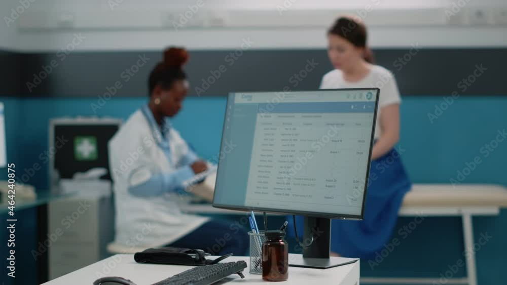Close up of medical information on computer monitor in cabinet for healthcare consultation. Doctor and patient doing examination while having desk with device and medical equipment Close up of medical information on computer monitor in cabinet for healthcare consultation. Doctor and patient doing examination while having desk with device and medical equipment