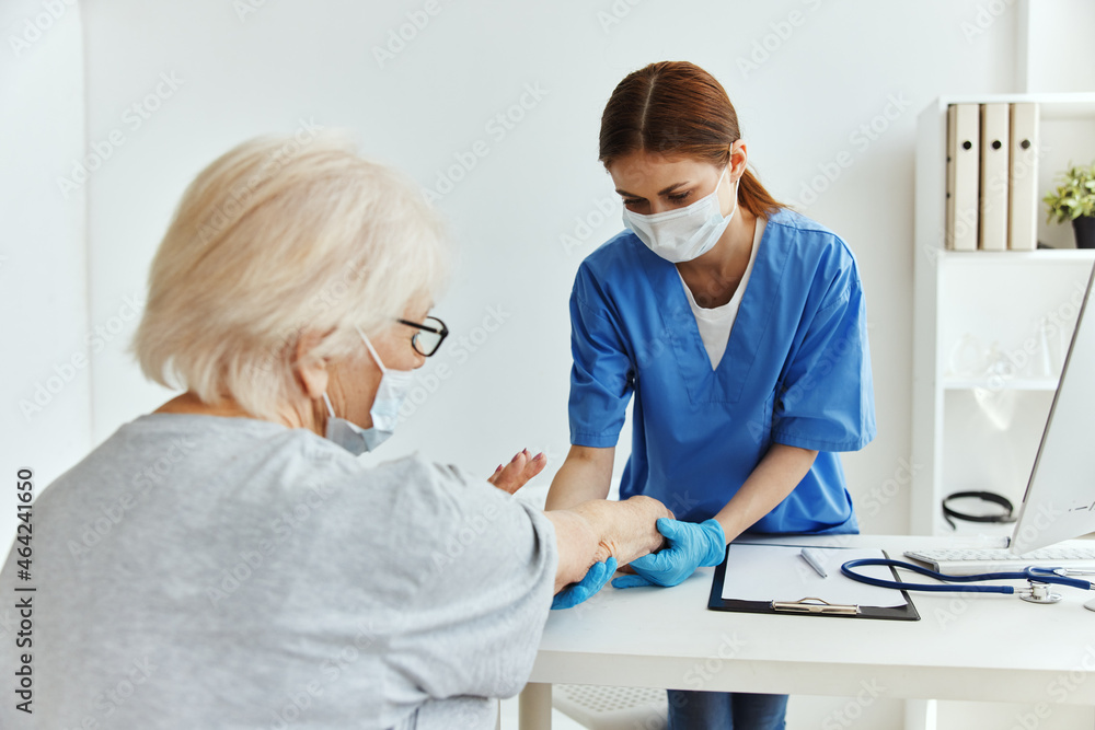 Fototapeta premium elderly woman and doctor professional examination medical office