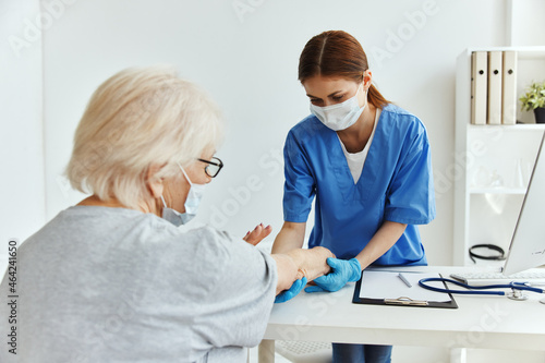 elderly woman and doctor professional examination medical office