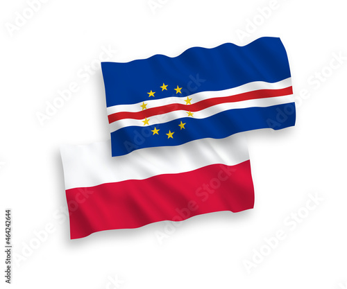 National vector fabric wave flags of Republic of Cabo Verde and Poland isolated on white background. 1 to 2 proportion.