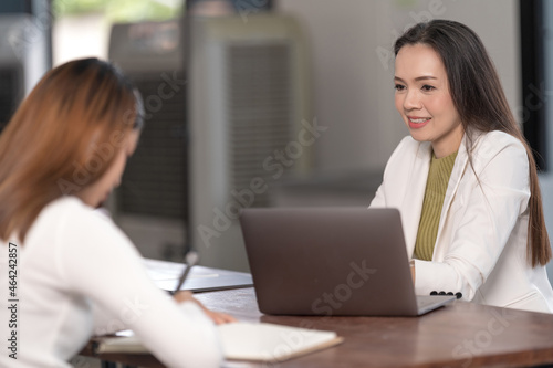 College instructors and advisors meet female college students to advise their research study. Education Concept Stock Photo photo