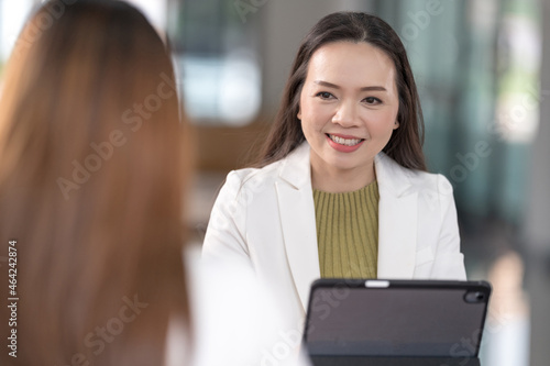 College instructors and advisors meet female college students to advise their research study. Education Concept Stock Photo photo