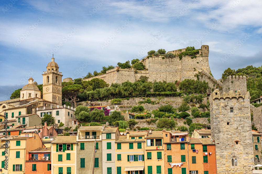 Cityscape of Porto Venere or Portovenere village, view from the sea with the colorful houses-tower, UNESCO world heritage site, Gulf of La Spezia, Liguria, Italy, Europe.