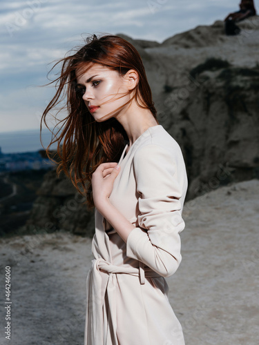 beautiful woman in coat posing beach fresh air lifestyle fashion © SHOTPRIME STUDIO