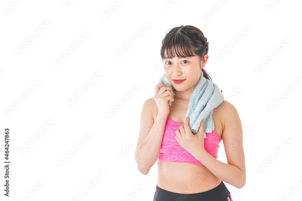 タオルで汗を拭く女性 タオルで汗を拭く女性