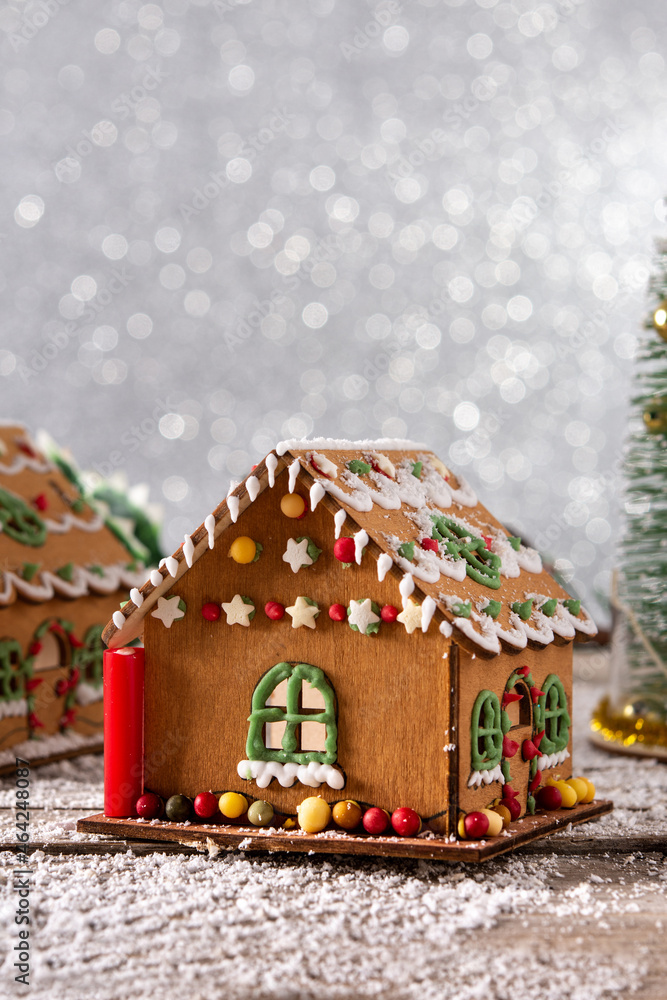 Christmas gingerbread house on wooden table. Copy space