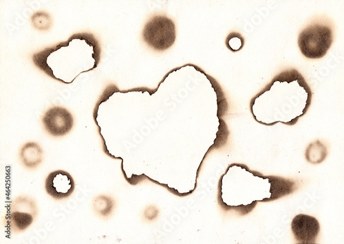 Vintage burned paper edges heart background