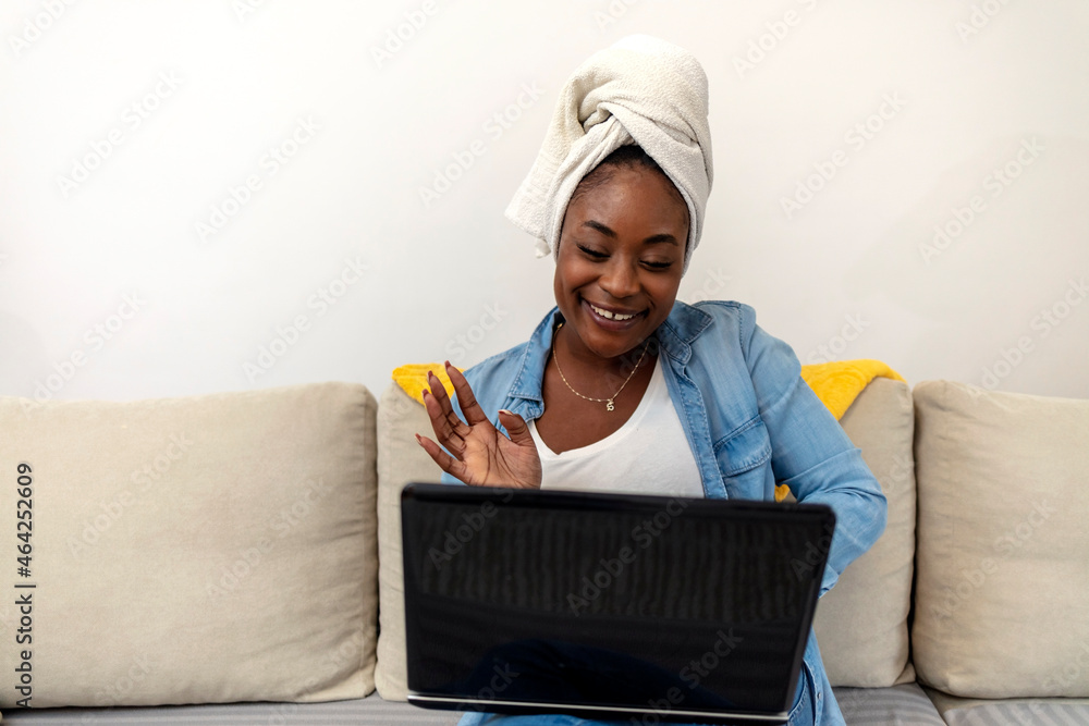 Cropped shot of an attractive young woman using a laptop while relaxing on her couch at home. Shot of a young woman using her laptop while relaxing on the sofa at home, copy space. Cropped shot of an attractive young woman using a laptop while relaxing on her couch at home. Shot of a young woman using her laptop while relaxing on the sofa at home, copy space.