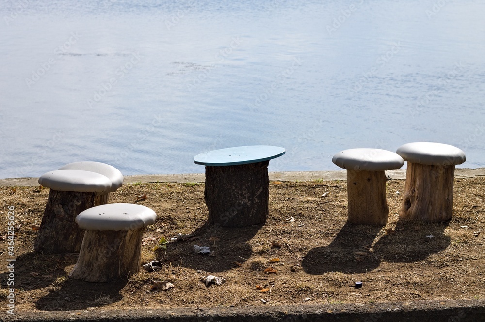 Mushroom-shaped seats made from wood logs along the shore of Lake Trasimeno (Umbria, Italy, Europe) Mushroom-shaped seats made from wood logs along the shore of Lake Trasimeno (Umbria, Italy, Europe)