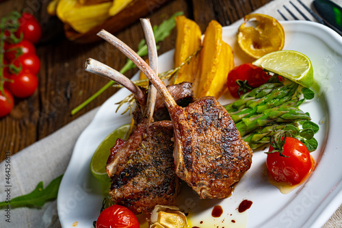 Lamb chops marinated in herbs with green asparagus and lime