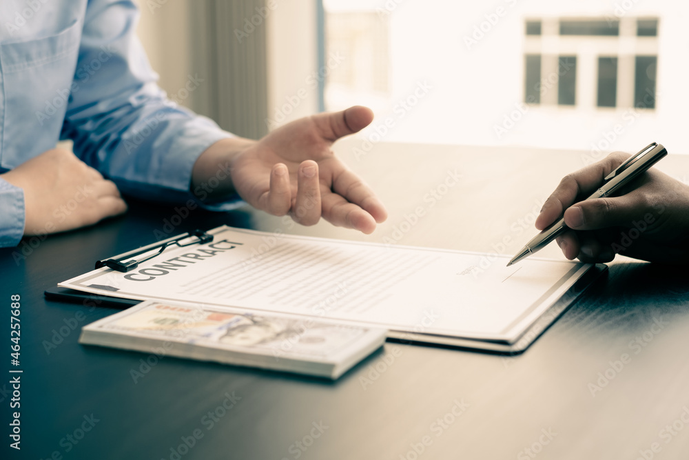 Corruption. Businessmen make an agreement with the money proposed his partner to bribe in the office and make a contract under an agreement. Illegal money fraud The concept of bribery and corruption Corruption. Businessmen make an agreement with the money proposed his partner to bribe in the office and make a contract under an agreement. Illegal money fraud The concept of bribery and corruption