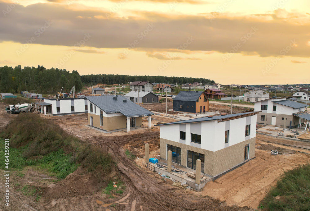 Building a country house of expanded-clay concrete blocks. Unfinished private home of ceramsite concrete blocks on a construction site.Construction work and laying bricks and roof. Suburb houses.