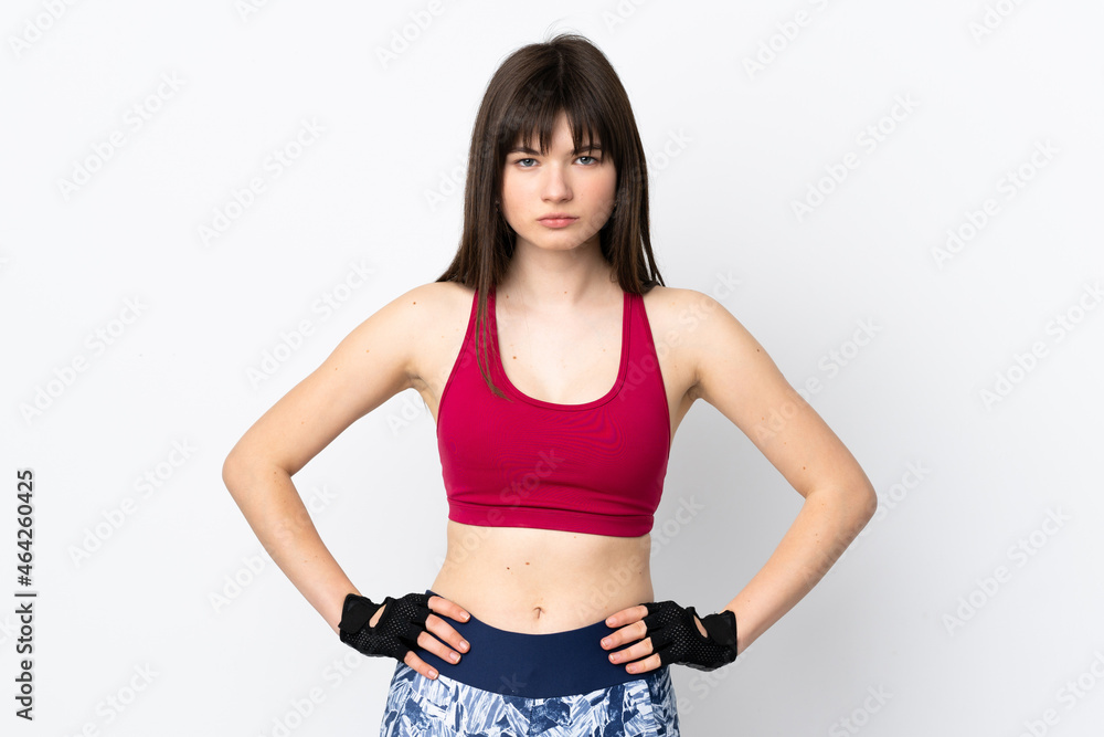 Young sport woman isolated on white background posing with arms at hip Young sport woman isolated on white background posing with arms at hip