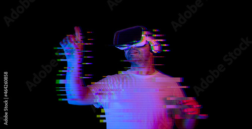 Young man using vr glasses with glitch effect. new virtual world metaverse
