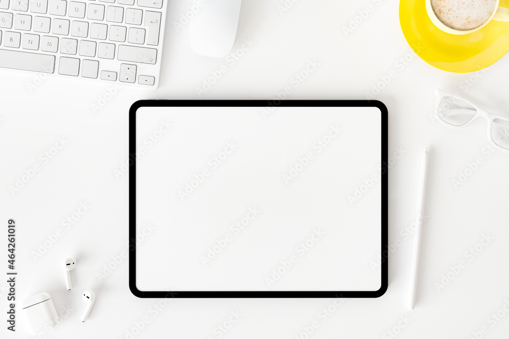 Top view of blank screen tablet on white working desk Top view of blank screen tablet on white working desk