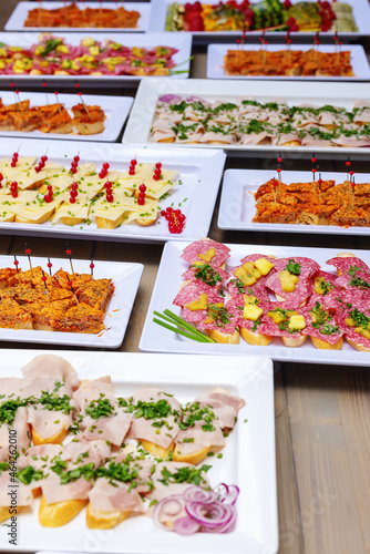 plates with different appetizers on a table of a buffet