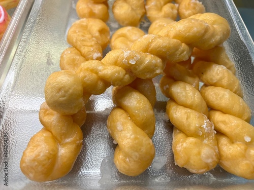 Close-up photo of Sugar twist, a dessert made from flour and sugar. It is commonly consumed by the general public. It smells delicious and colorful.