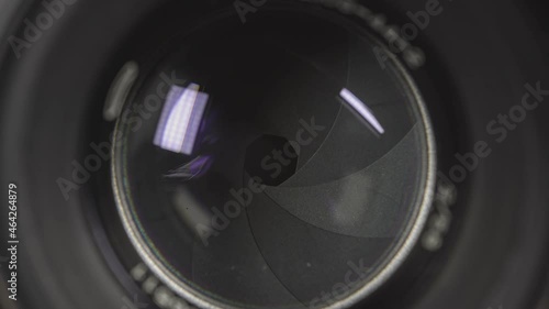 Diaphragm blades of the fixed lens opening and closing aperture f-stop 2 photo