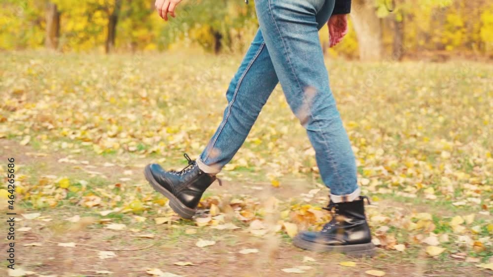 Girl tourist on a hike in the autumn forest