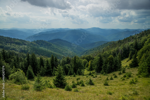 dramatic beautiful Carpathian Mountains nature landscape photography from above with horizon view of sun light rays