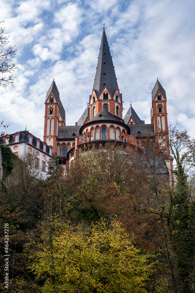 View towards the magnificent cathedral of Limburg an der Lahn / Germany in autumn against a white-blue sky 
