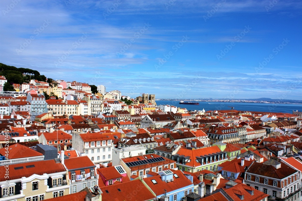 Lisbon, Portugal - June, 2019: Panoramic view of the Lisbon rooftops and the Douro River from the observation deck of Santa Justa elevator.