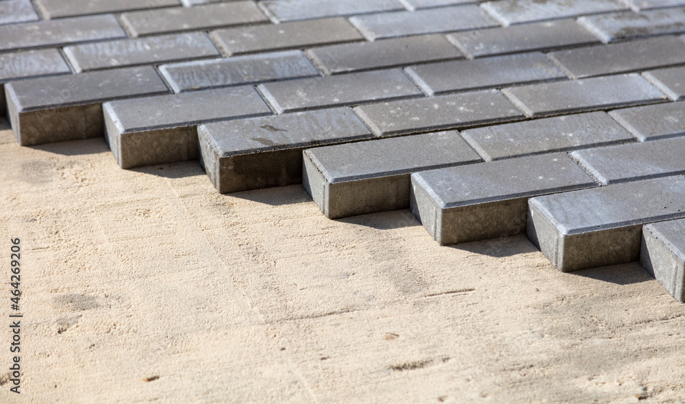 Laying paving slabs at a construction site. Laying paving slabs at a construction site.