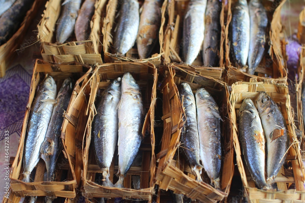Pindang fish (salted fish) in a bamboo container at the traditional ...