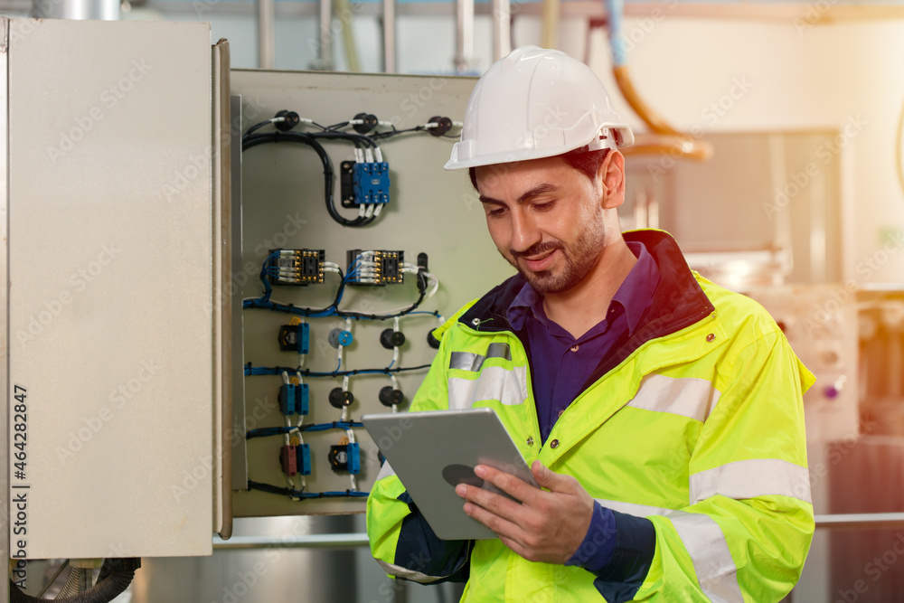 engineer worker working checking maintenance electricity fuse box in and power line in factory. engineer worker working checking maintenance electricity fuse box in and power line in factory.