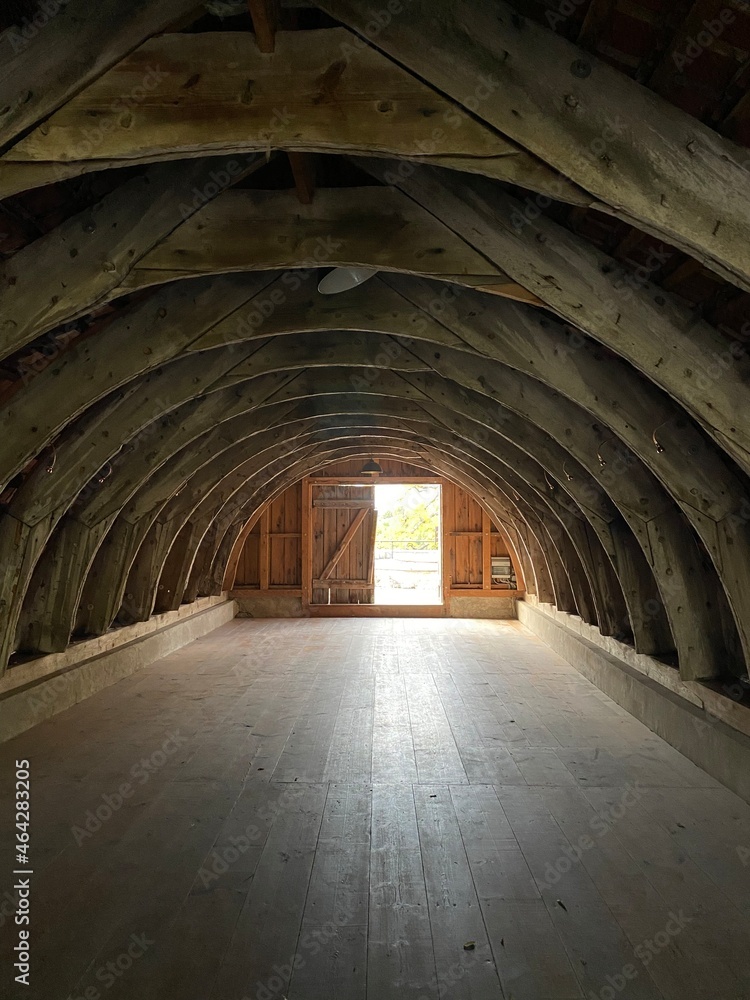 an old building with wooden floors and an arched roof