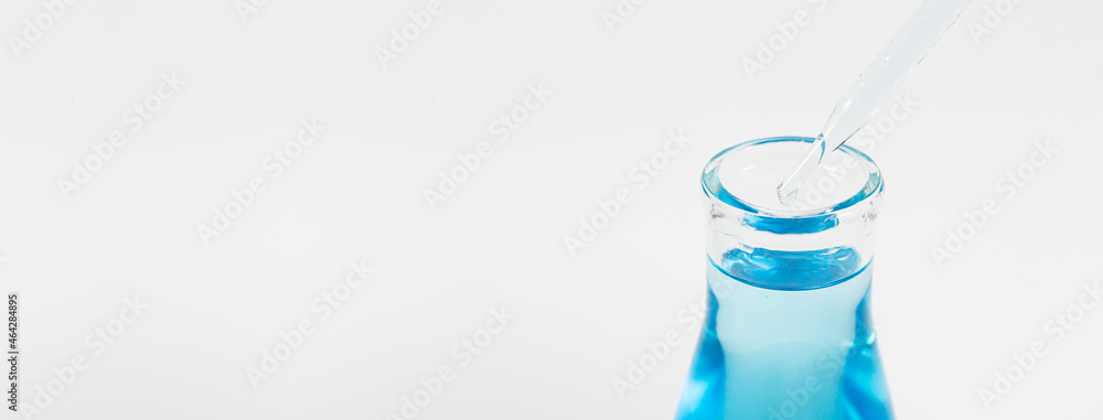 blue liquid pipette and bottle see lab images,Genetic research and Biotech science Concept. Human Biology and pharmaceutical technology on laboratory background. blue liquid pipette and bottle see lab images,Genetic research and Biotech science Concept. Human Biology and pharmaceutical technology on laboratory background.