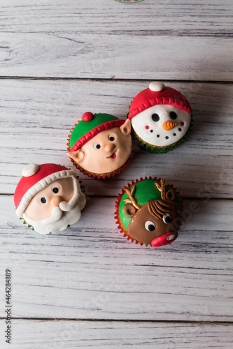 Christmas cupcakes on white table