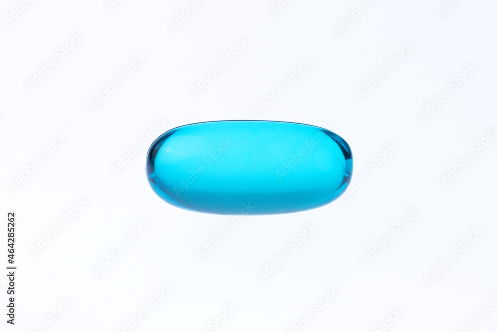 macro shot blue gel tab pill on a white background with copy space macro shot blue gel tab pill on a white background with copy space