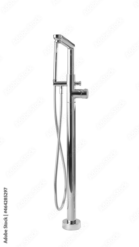 Modern bathtub faucet with hand shower on grey background Modern bathtub faucet with hand shower on grey background