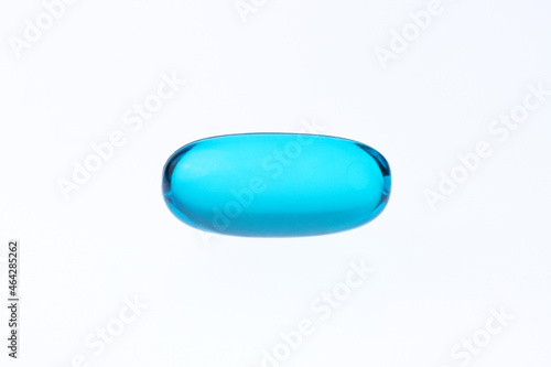 macro shot blue gel tab pill on a white background with copy space