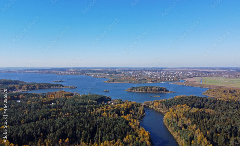 Aerial view of a large river and forest. Autumn panoramic landscape