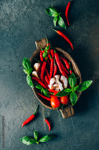 Fresh vegetables in a wooden bowl on a dark background
