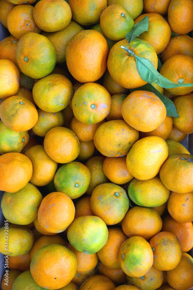 Wooden crate filled with fresh tangerines. Top view. Wooden crate filled with fresh tangerines. Top view.