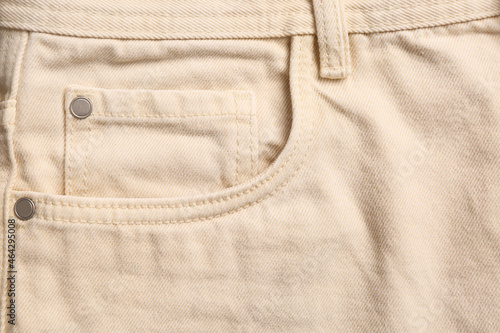 Konstfotografi Beige jeans with inset pocket as background, closeup