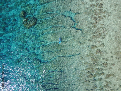 blue ocean paint background summer surf man adventure nature sea corals island Bali Indonesia 