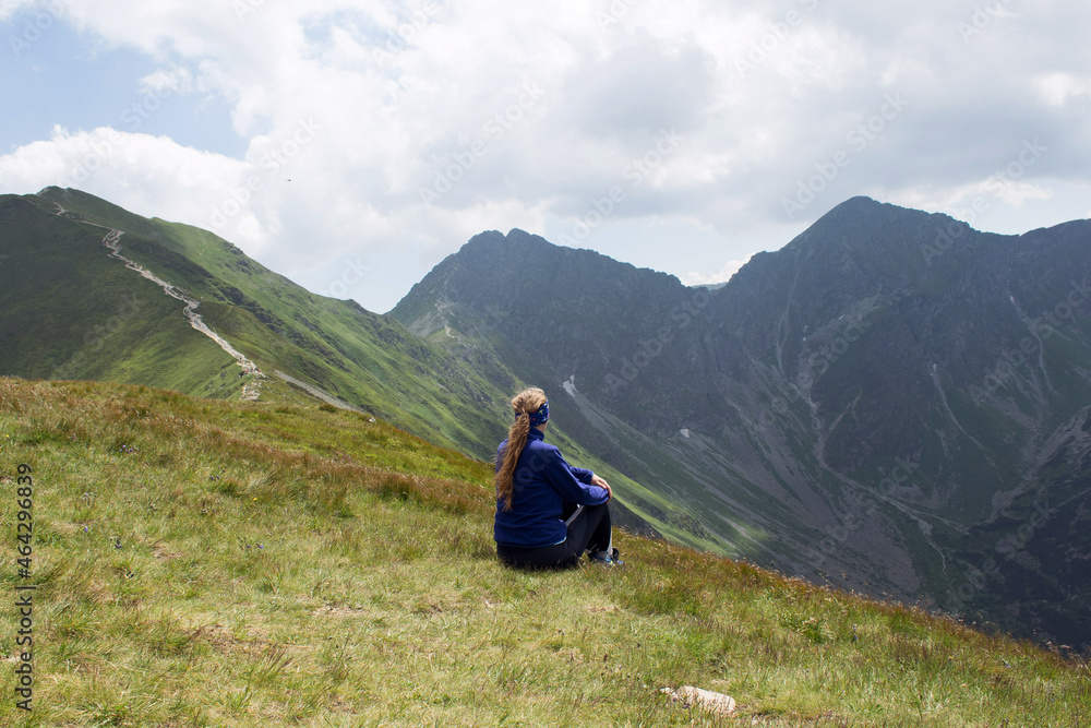 Naklejka premium hiker in the mountains girl woman tatra mountains poland