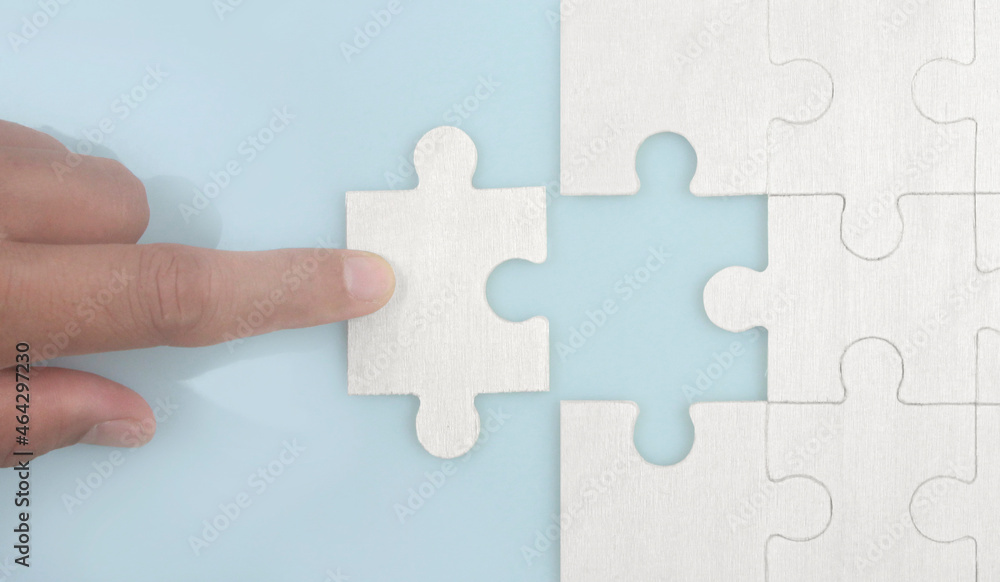 Connecting jigsaw puzzle . Business solutions success and strategy concept Connecting jigsaw puzzle . Business solutions success and strategy concept