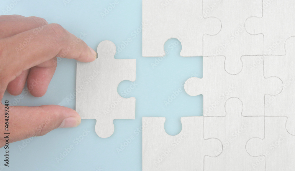 Connecting jigsaw puzzle . Business solutions success and strategy concept Connecting jigsaw puzzle . Business solutions success and strategy concept